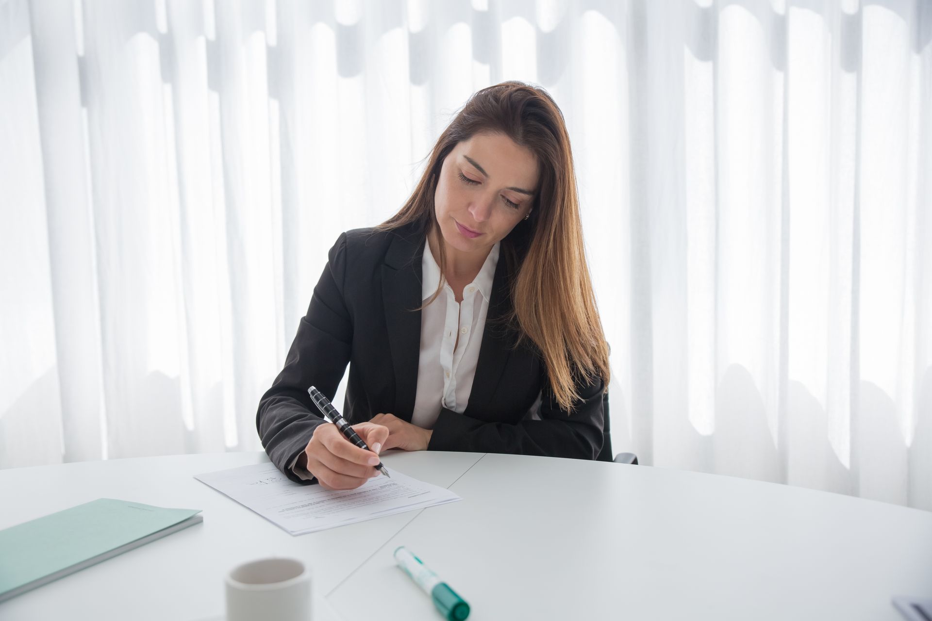 Businesswoman Signing Document