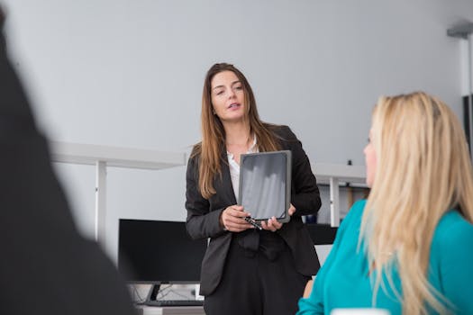 Professional woman delivering a digital presentation using a tablet in a modern office setting.