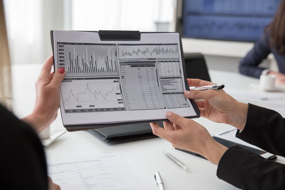 Advisers reviewing financial documents
