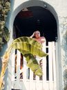 A Man Standing on an Arch Entryway