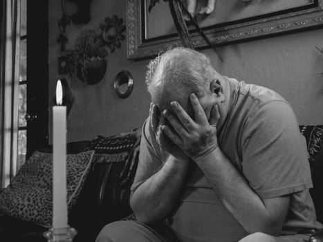Grayscale Photo of Man Covering His Face with Hands 