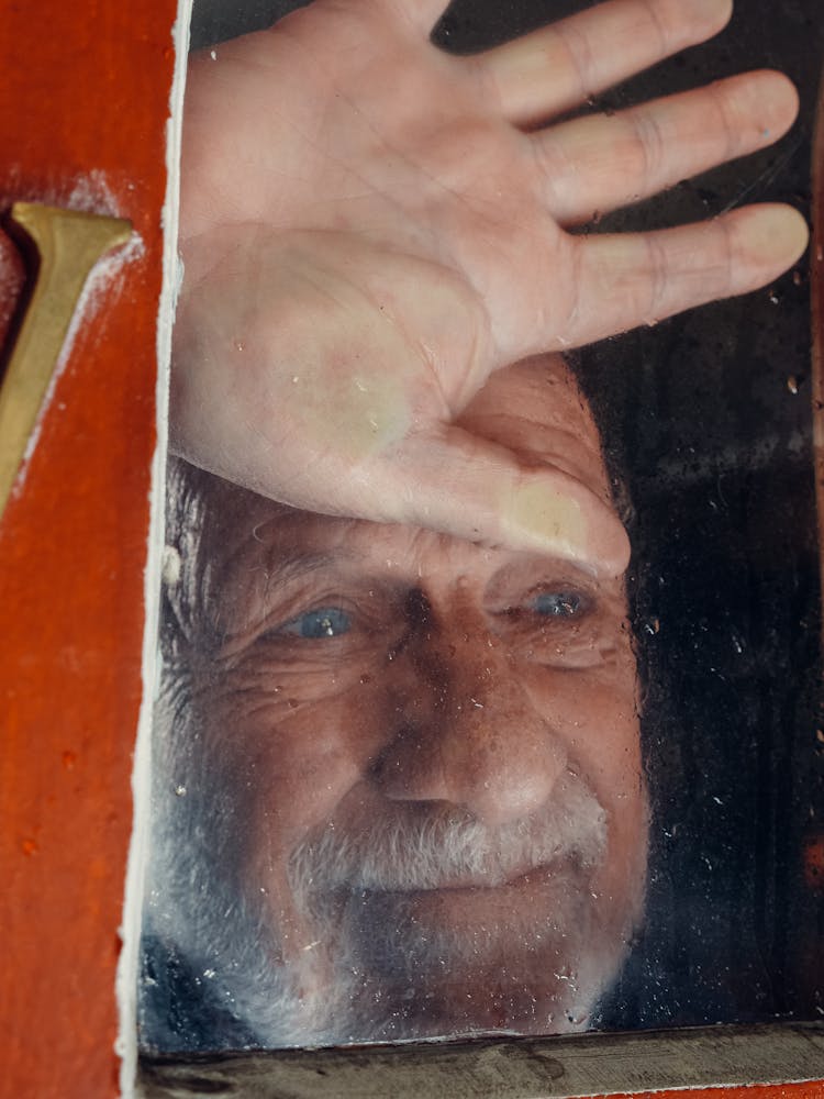  Elderly Man Looking Outside The Window