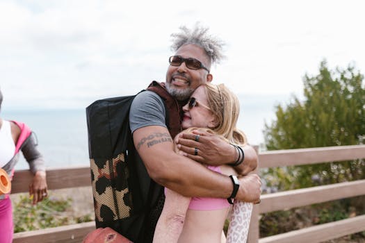 Elderly couple hugging and enjoying the outdoors, symbolizing love and wellness.