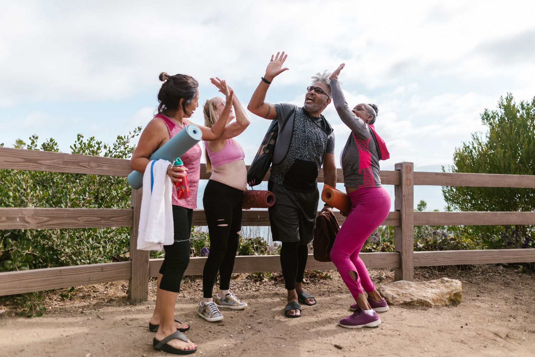 Friends celebrating after exercising outdoors