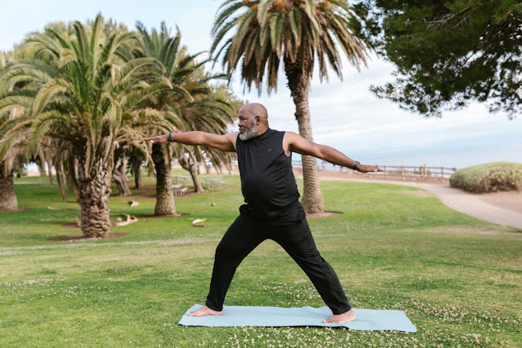 Bearded Man Doing Yoga At A Park