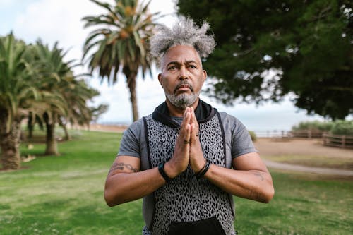 Senior Man Doing Yoga Exercise