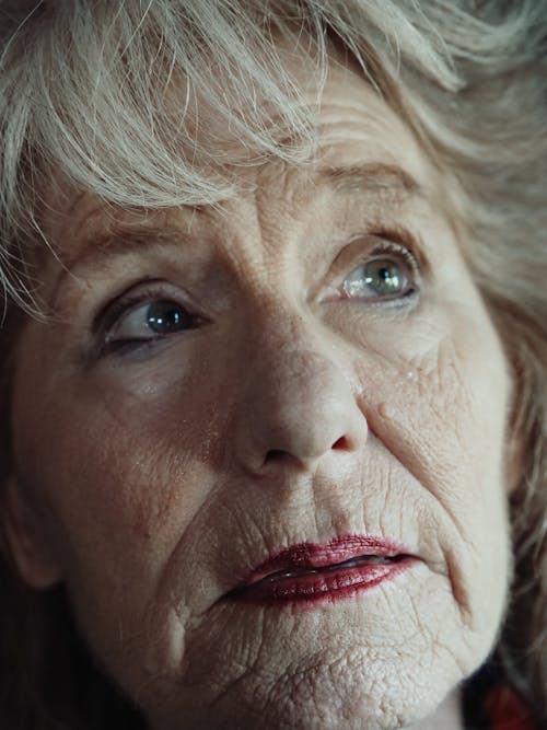 Elderly Woman's Face in Close Up Photography