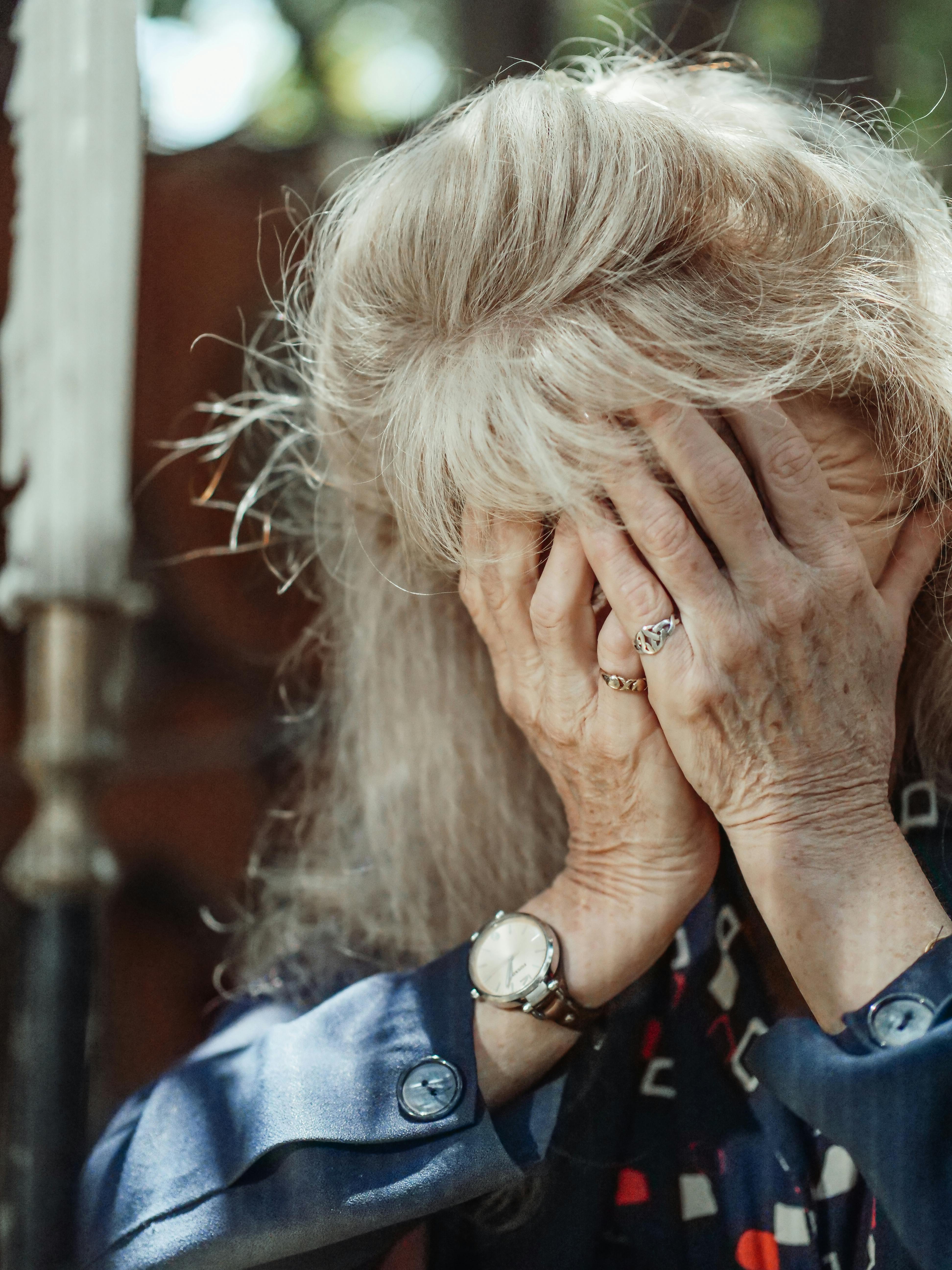 An Elderly Woman Covering Her Face · Free Stock Photo