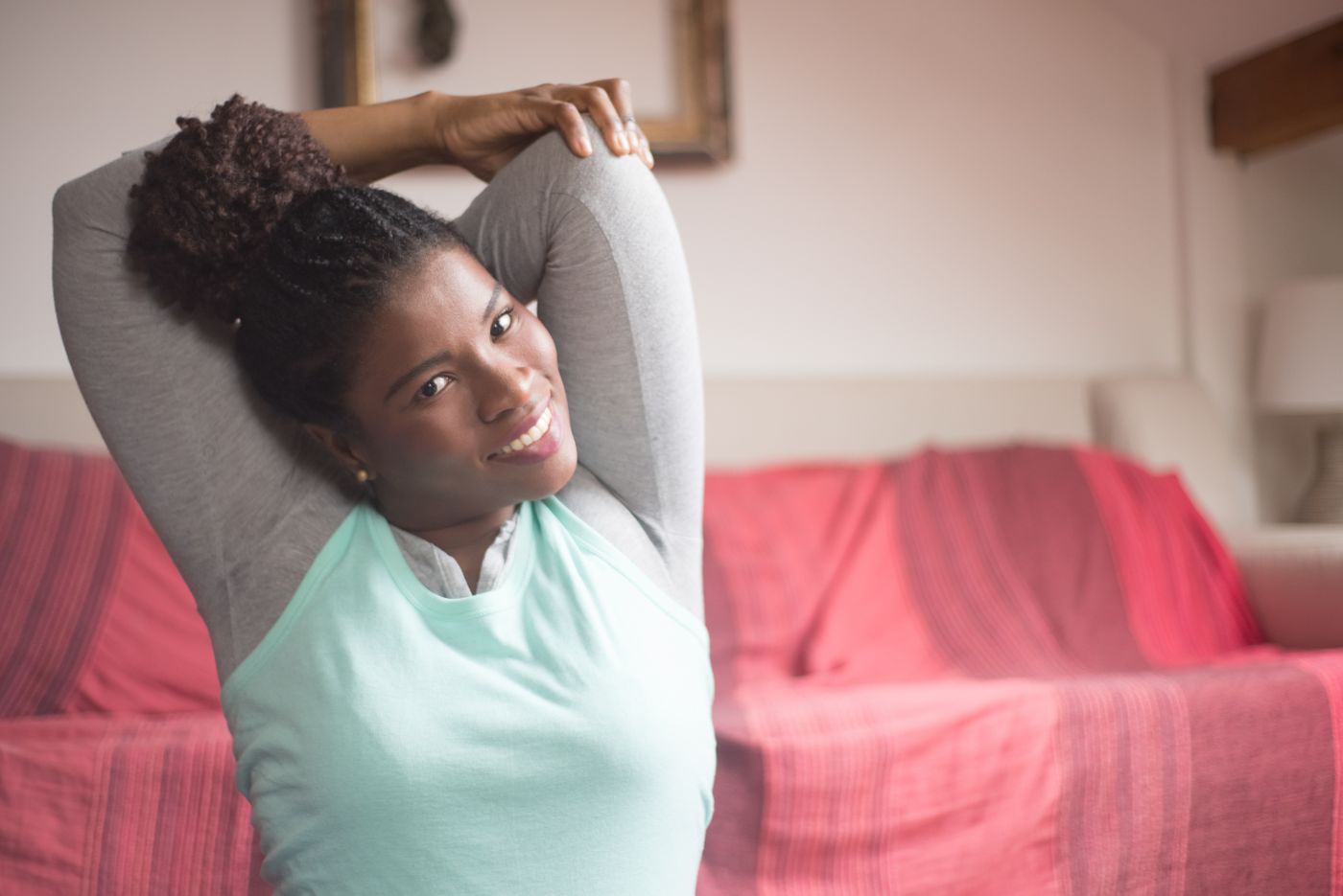 Black woman stretching during an at-home exercise session