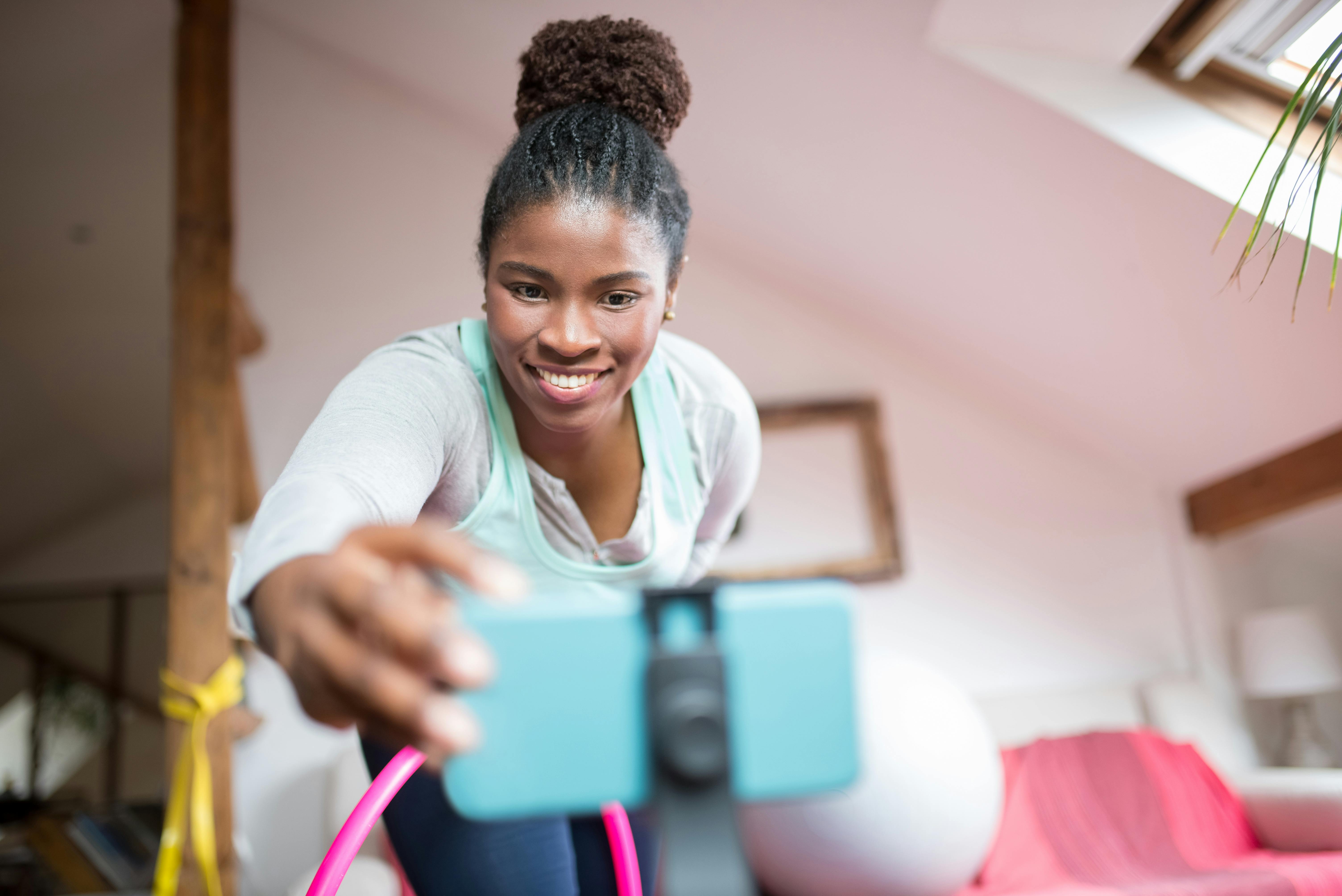 woman holding a smartphone taking selfie