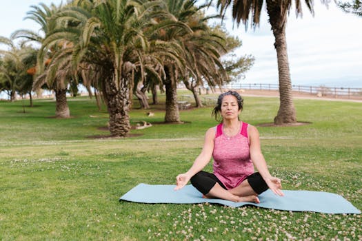 A senior woman meditating in a tranquil park setting on a yoga mat, surrounded by palm trees.