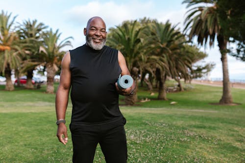 A Man Holding Yoga Mat