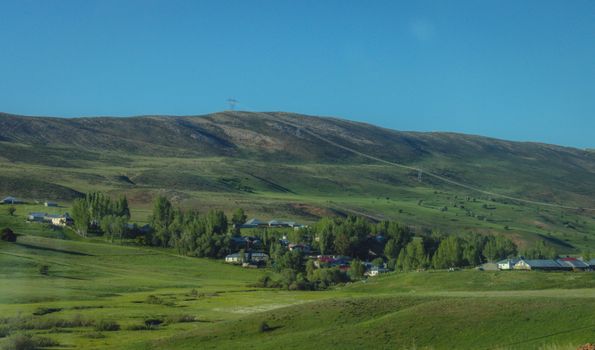 Discover the serene beauty of a countryside village nestled in Erzurum's greenery.