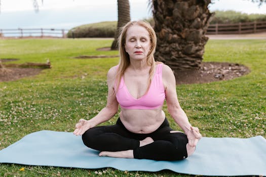 Senior woman meditating in yoga pose outdoors for a healthy lifestyle.