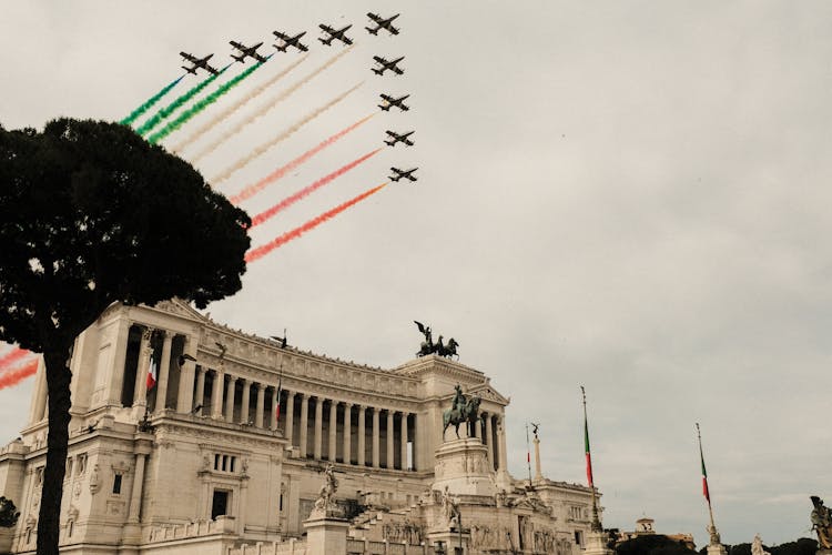 Air Show Above Victor Emmanuel Monument With Sculptures In City