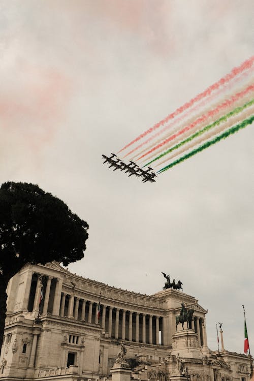 Free Air show above Victor Emmanuel Monument with statues in city Stock Photo