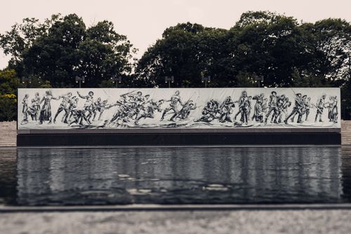 Free Mural depicting soldiers in action at Pershing Park's World War I Memorial. Stock Photo