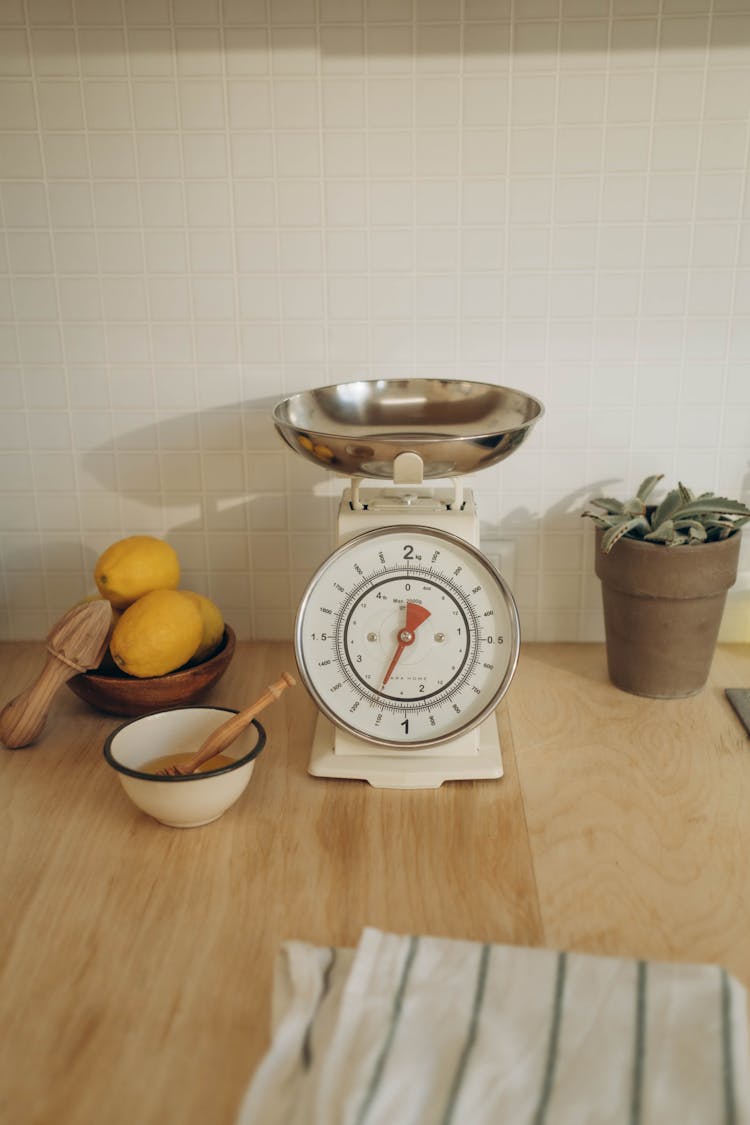 Kitchen Scale And Ingredients On Counter