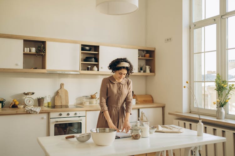 A Woman Cooking In The Kitchen