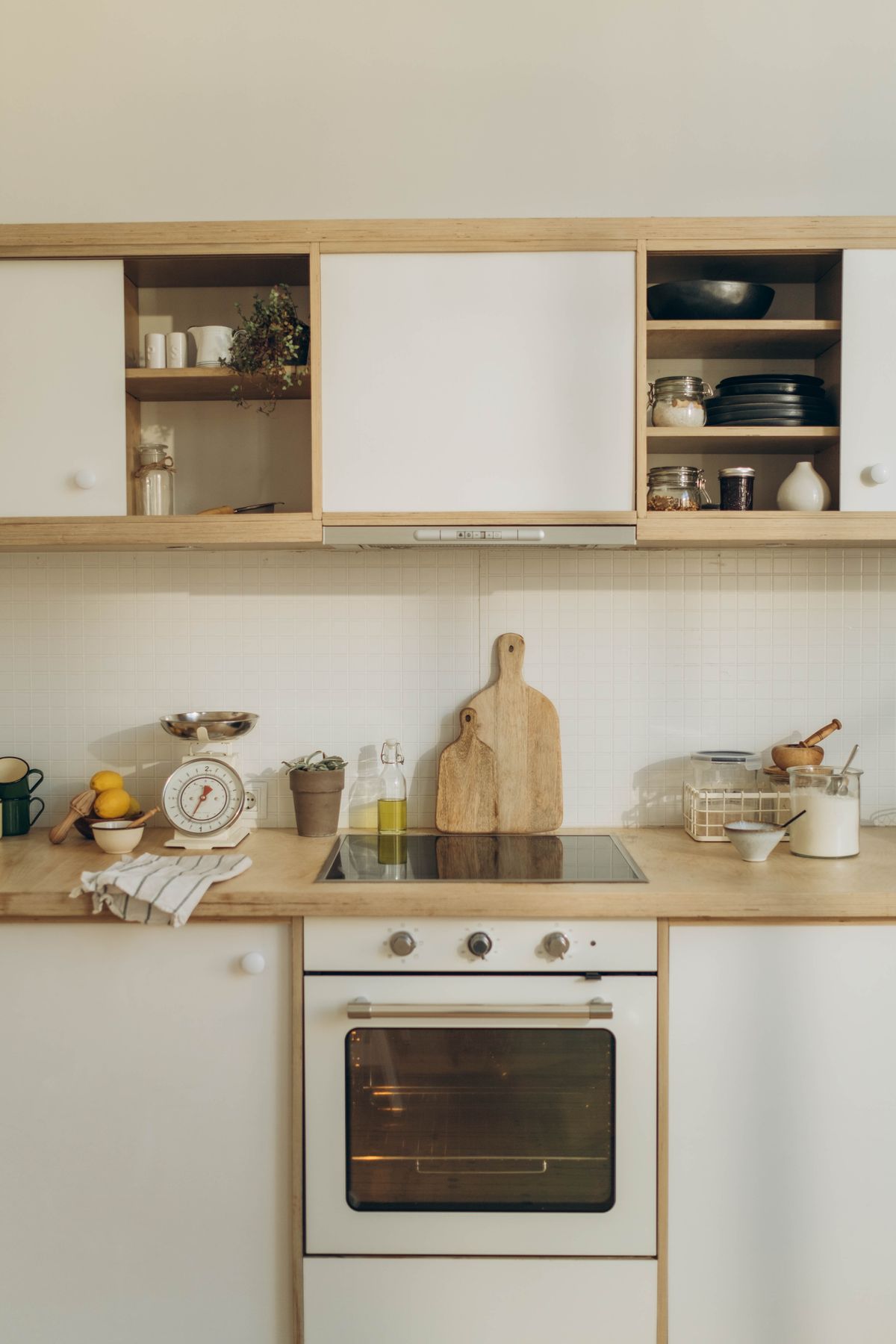 Well organized kitchen with wooden cabinets and countertop