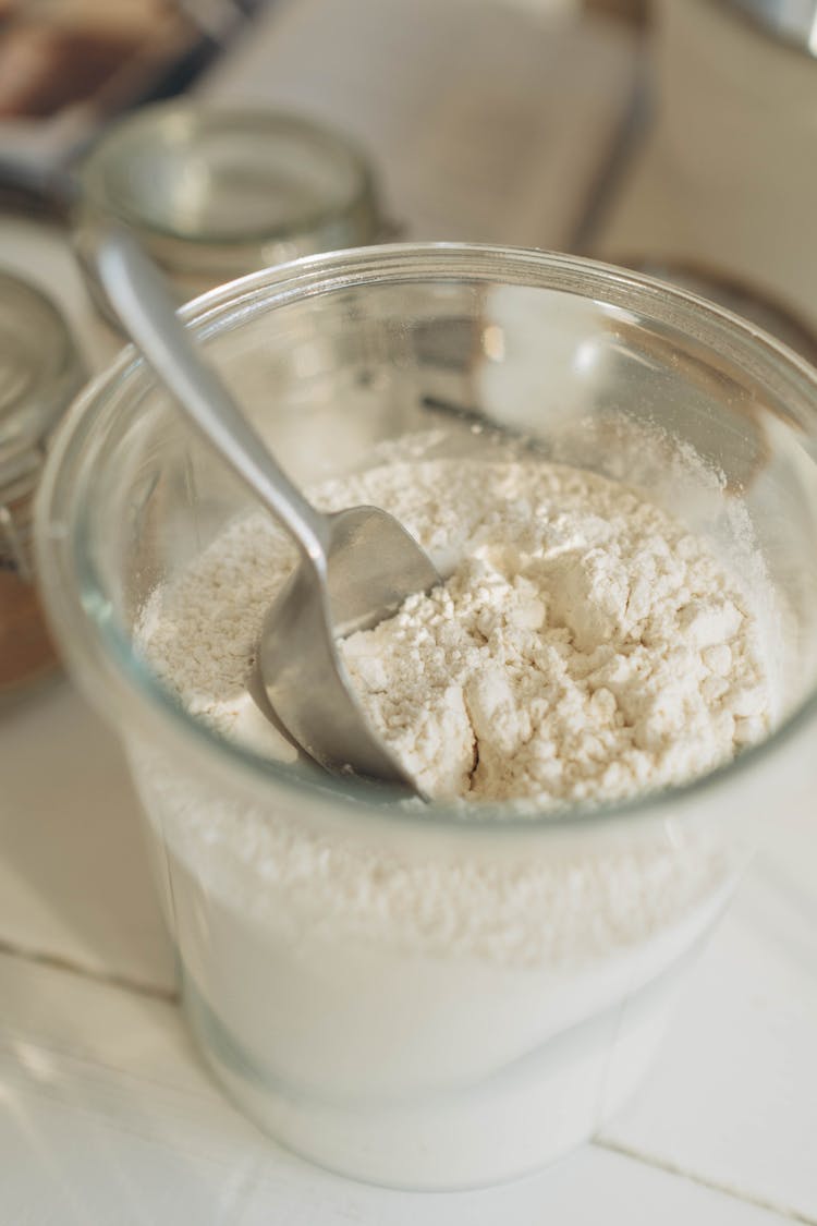 A Flour In A Glass Container