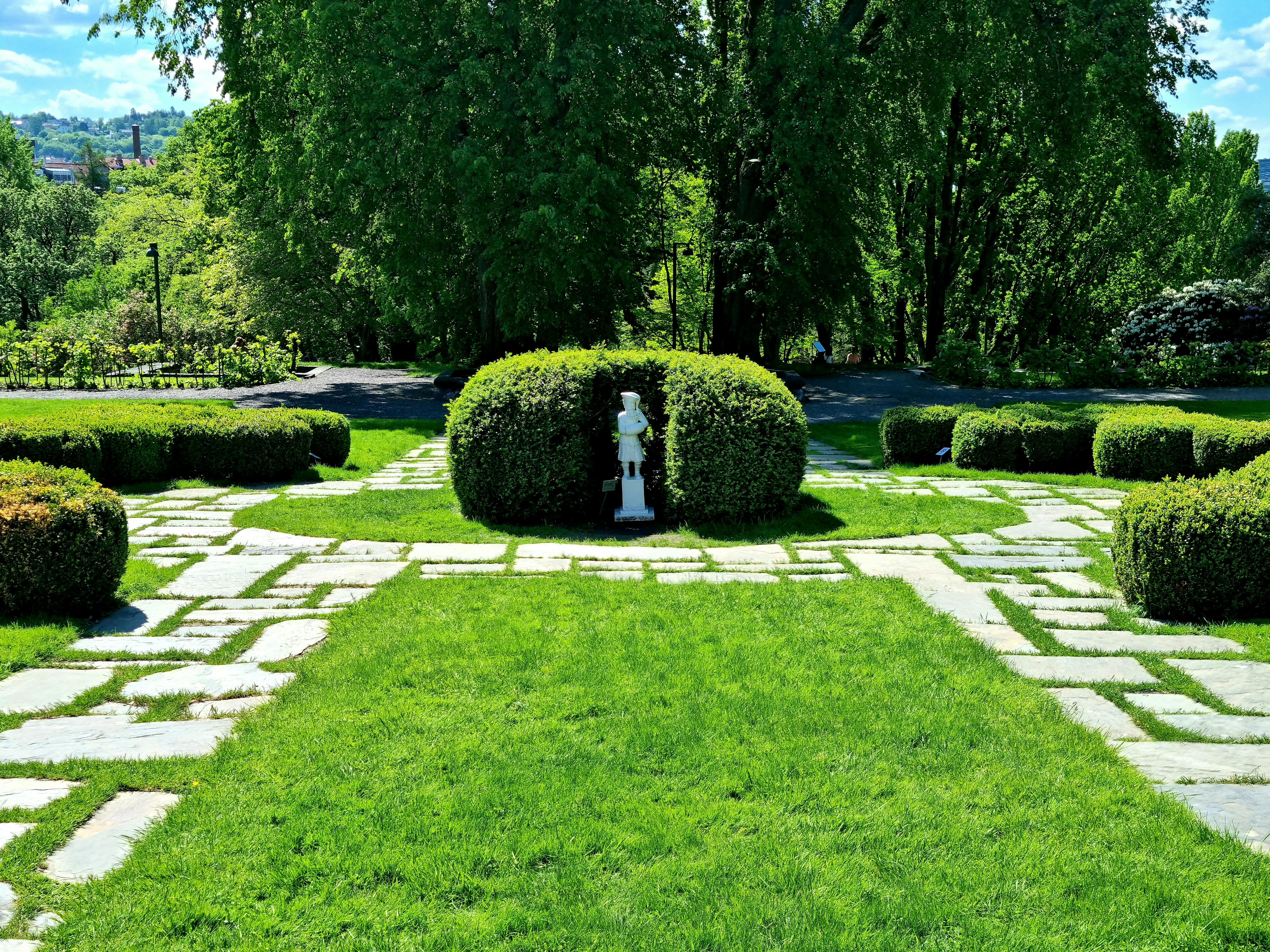 A person pouring a sparkling water mocktail with lime and mint into a glass