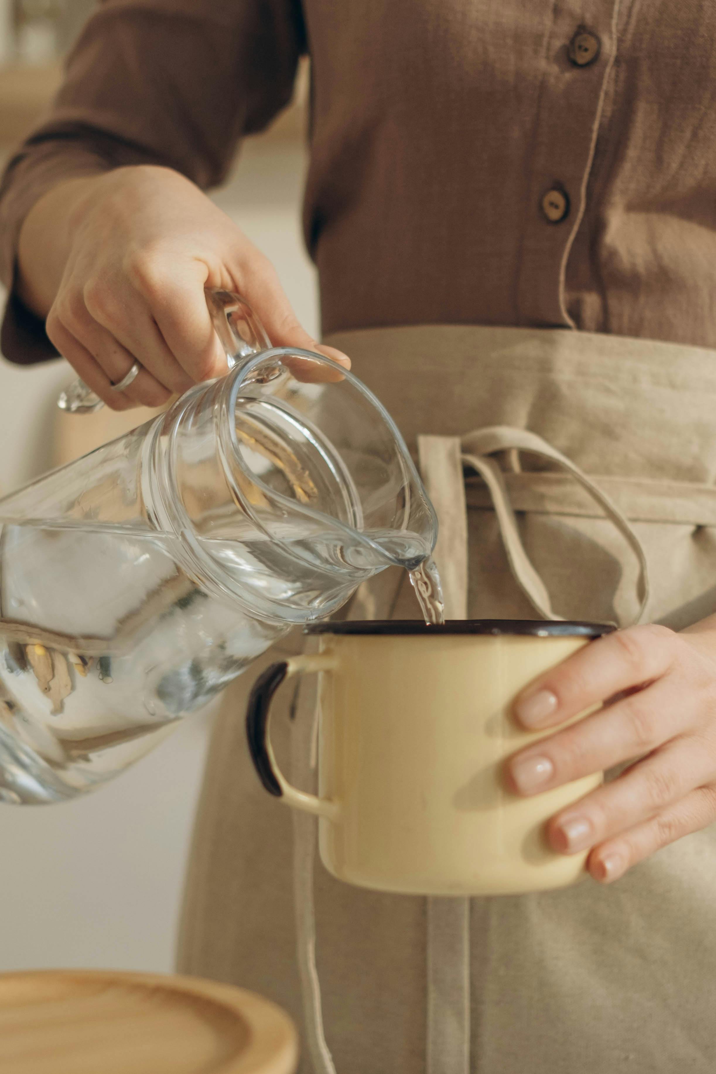 Hand Pouring Water from Glass Pitcher Stock Photo - Image of pouring,  refreshment: 61845744