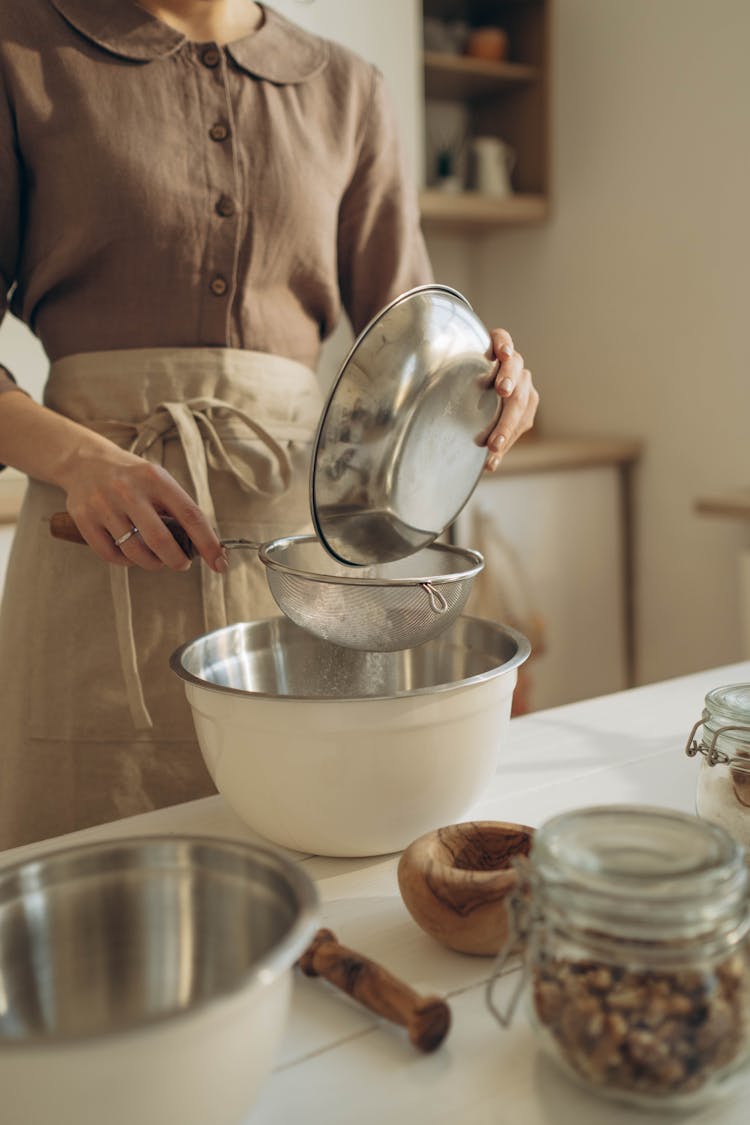 Woman Sifting Flour