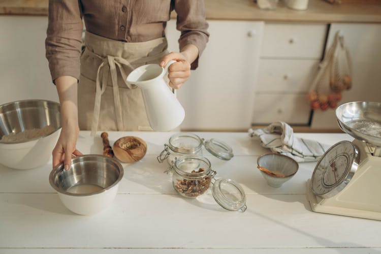 Woman Cooking In Kitchen