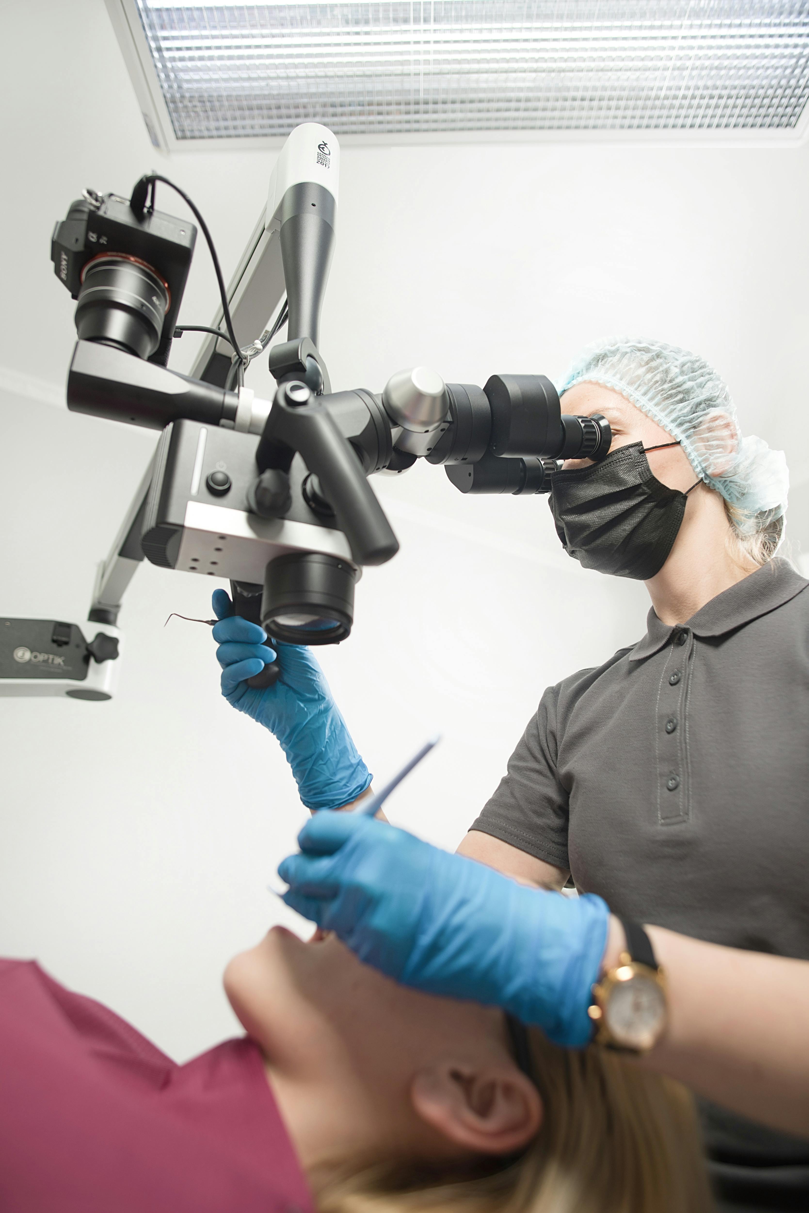 Dental professional using advanced technology in treatment