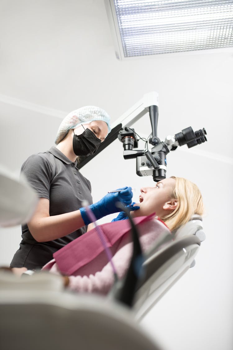 Woman During Dentist Treatment