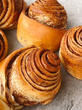Delicious cinnamon rolls fresh out of the oven, perfect for breakfast or dessert.