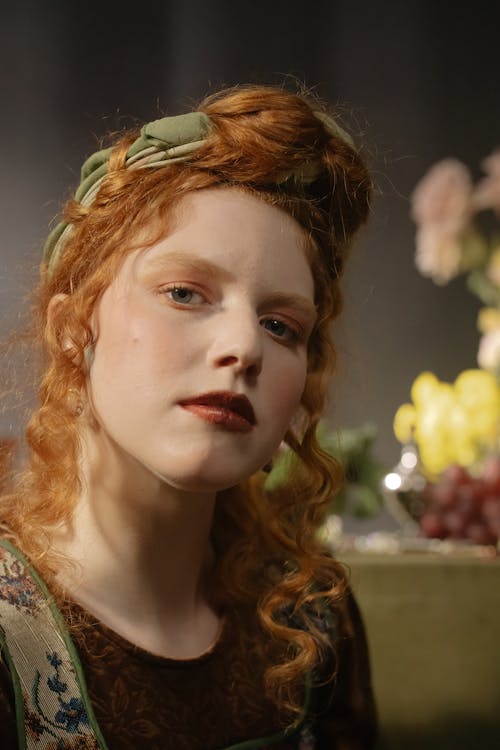 Portrait of a Red Haired Woman with Green Headband