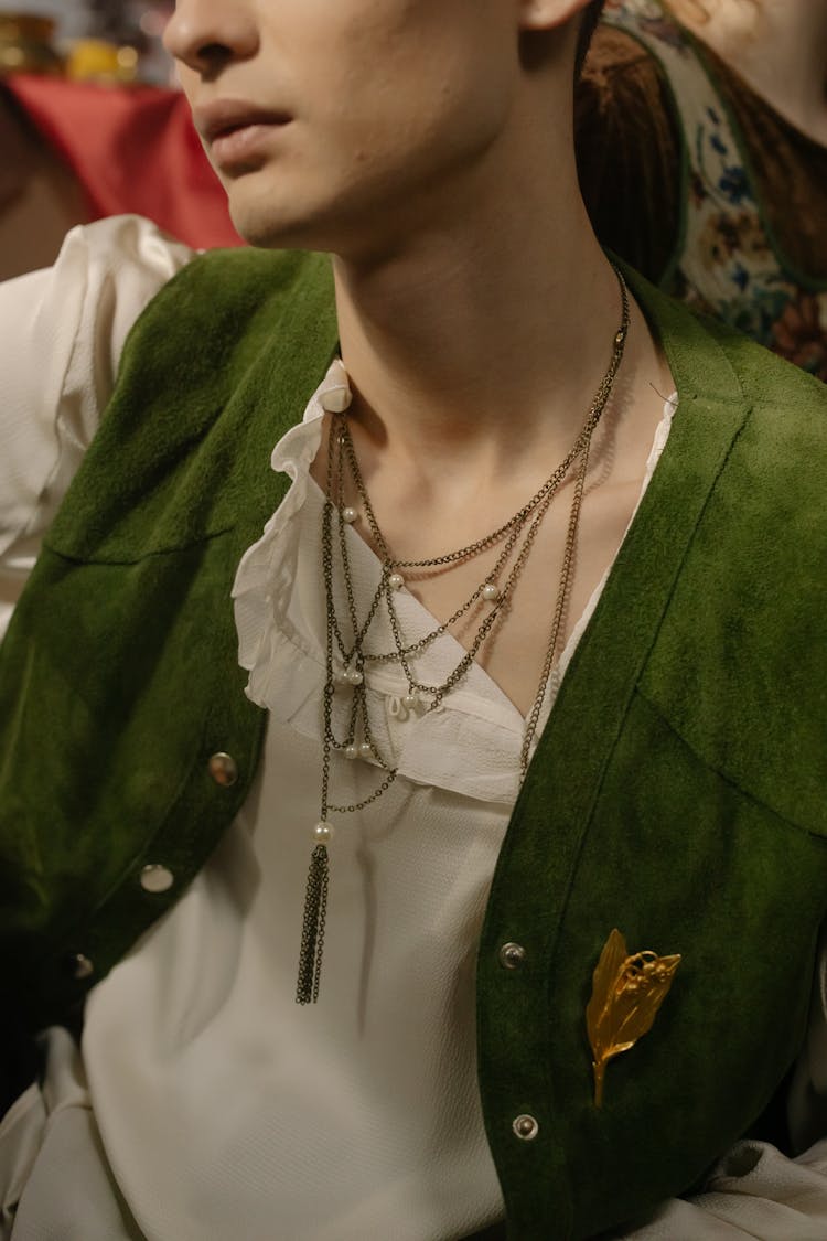 Woman In Green Velvet Vest Wearing Silver Necklaces