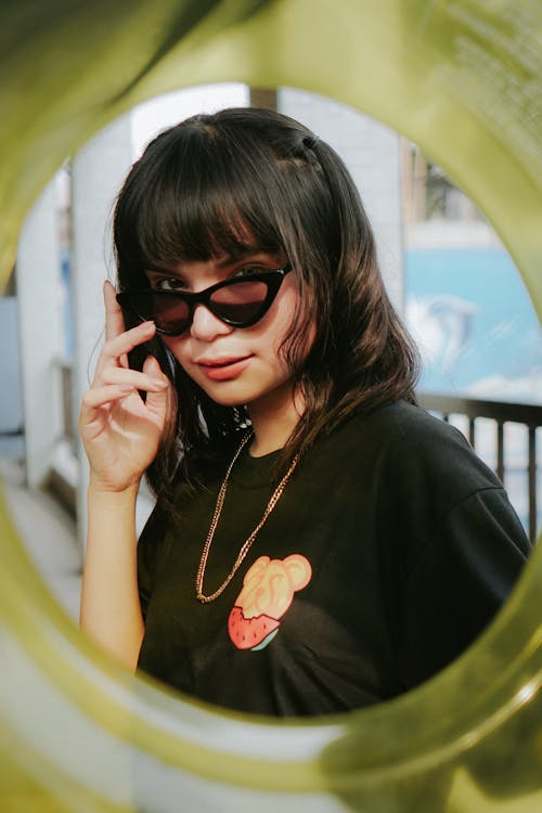Free Teenage Girl in Black Shirt Wearing Sunglasses Stock Photo