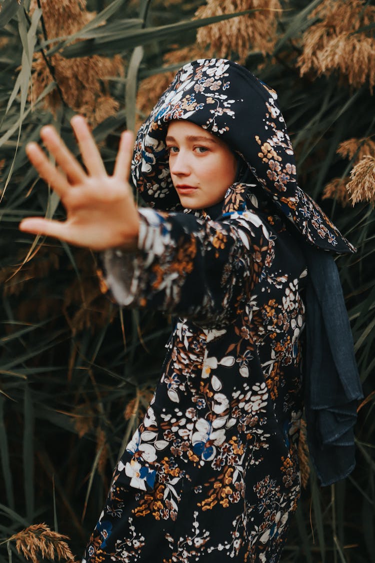 Woman In A Long Outfit With Outstretched Arm 