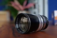 Black Camera Lens on Brown Wooden Table