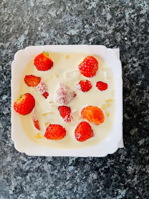 Strawberries and Milk on White Ceramic Bowl