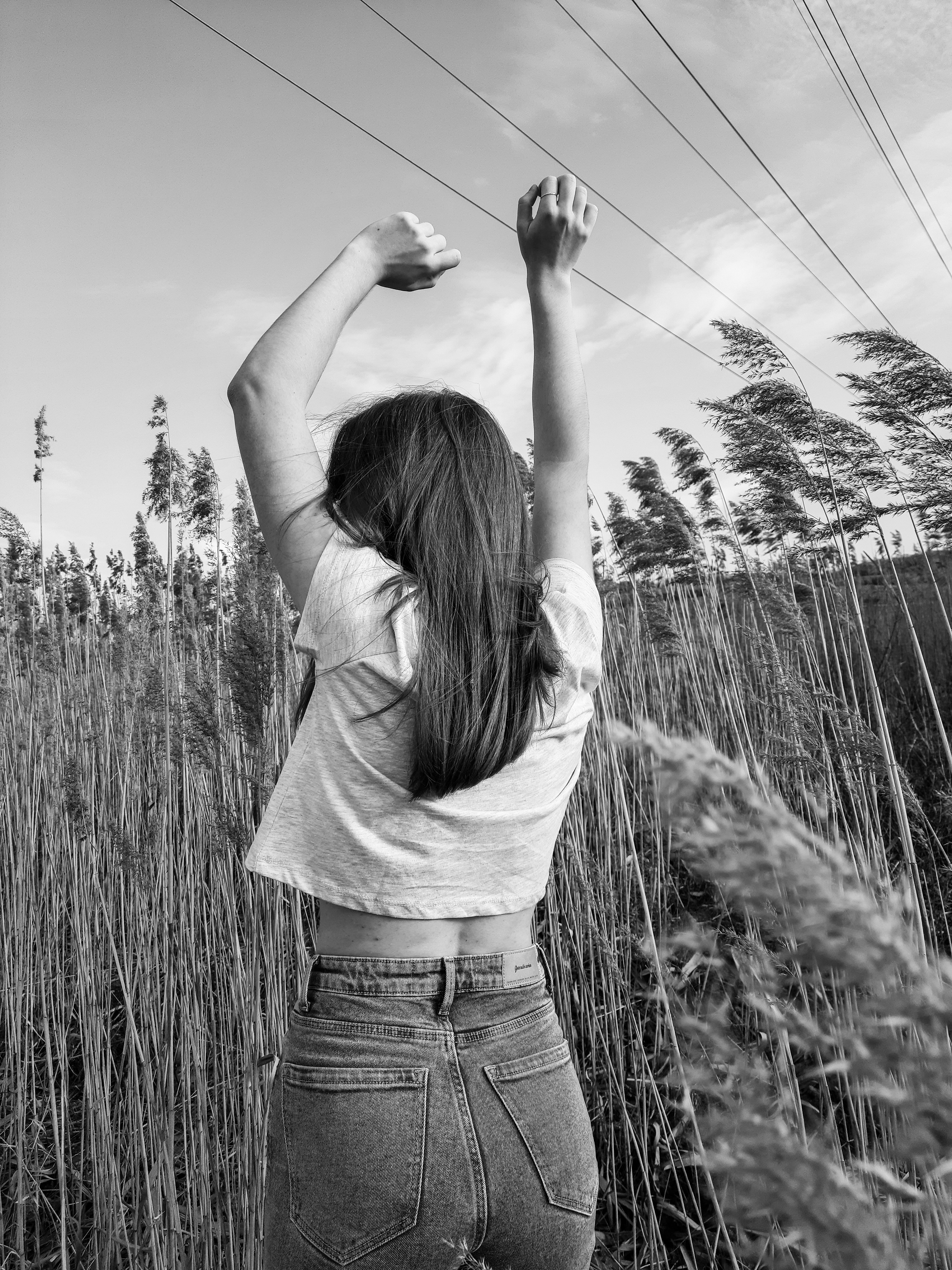 A Woman Standing on the Grass Field · Free Stock Photo