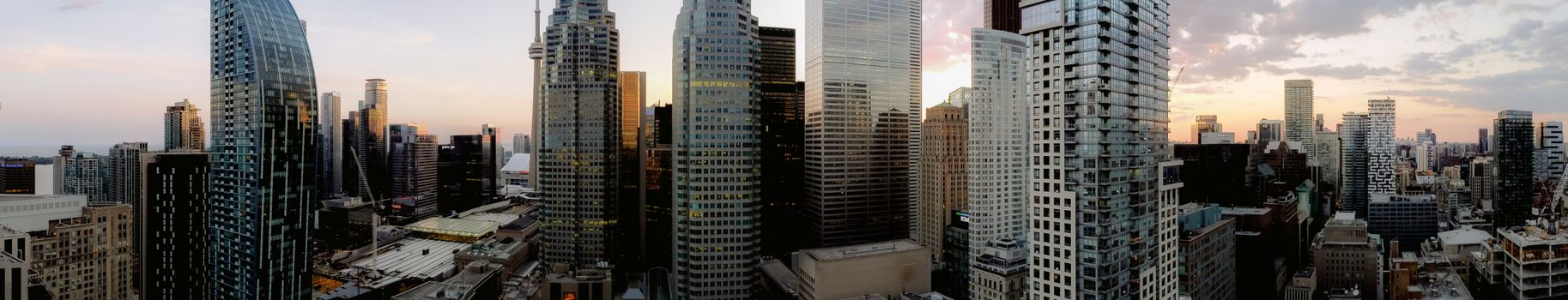 A breathtaking panoramic view of Toronto's skyscrapers during sunset.