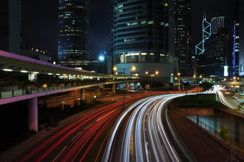 Free Light Trails on the Road Near Buildings Stock Photo