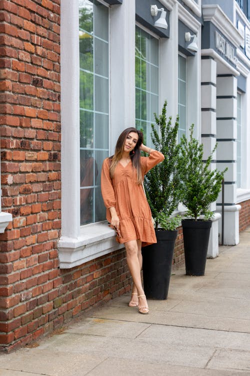 Photo of Woman in Orange Dress