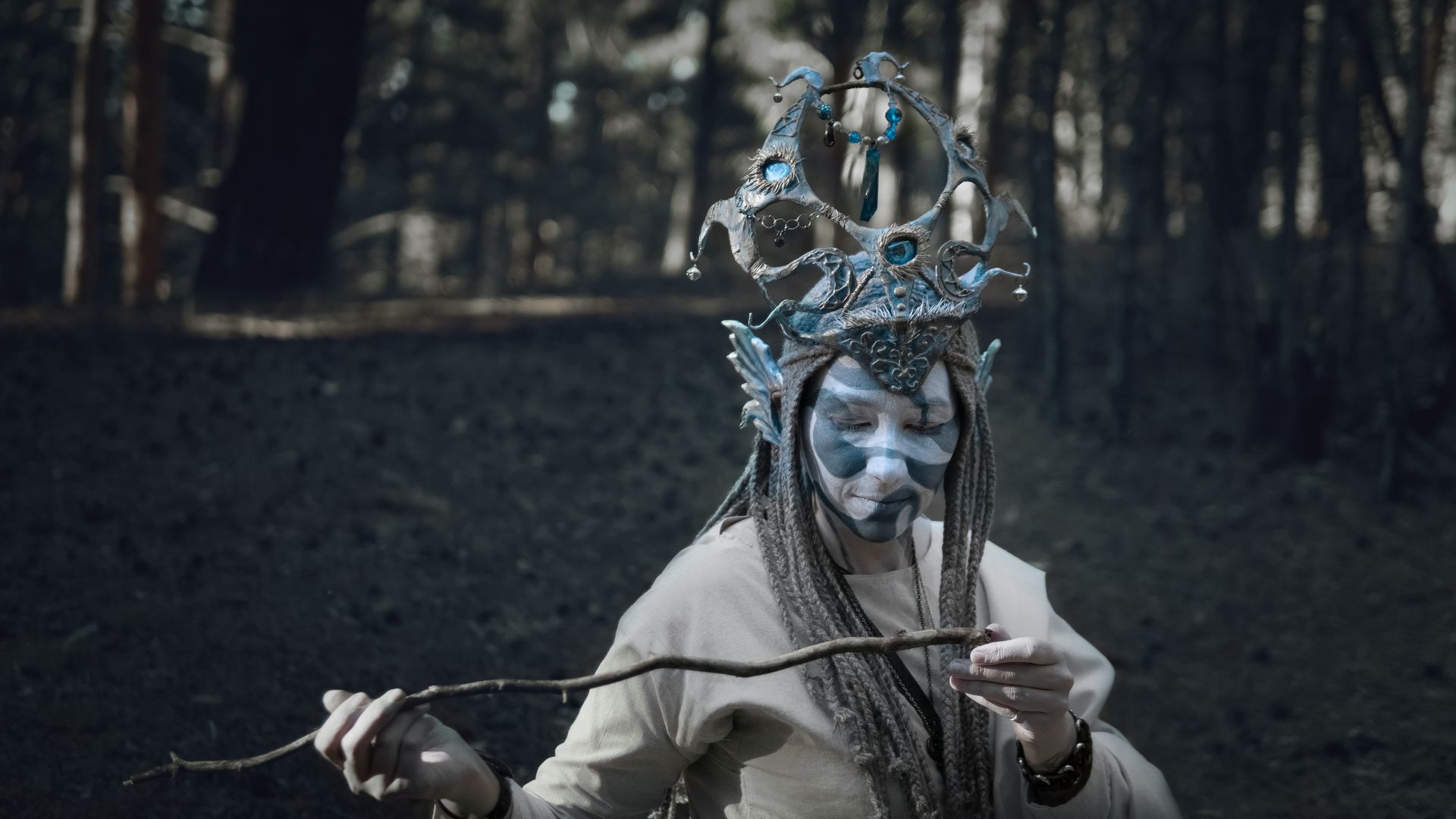 Woman in a Costume of a Mythical Creature in Woods