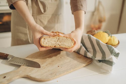 Free A Person Holding the Fresh Bread Stock Photo