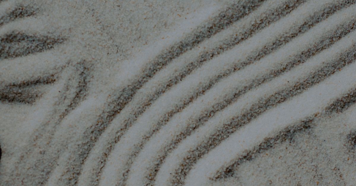 White Sand Rake Pattern Close-up of Rakes Pattern in Sand · Free Stock Photo