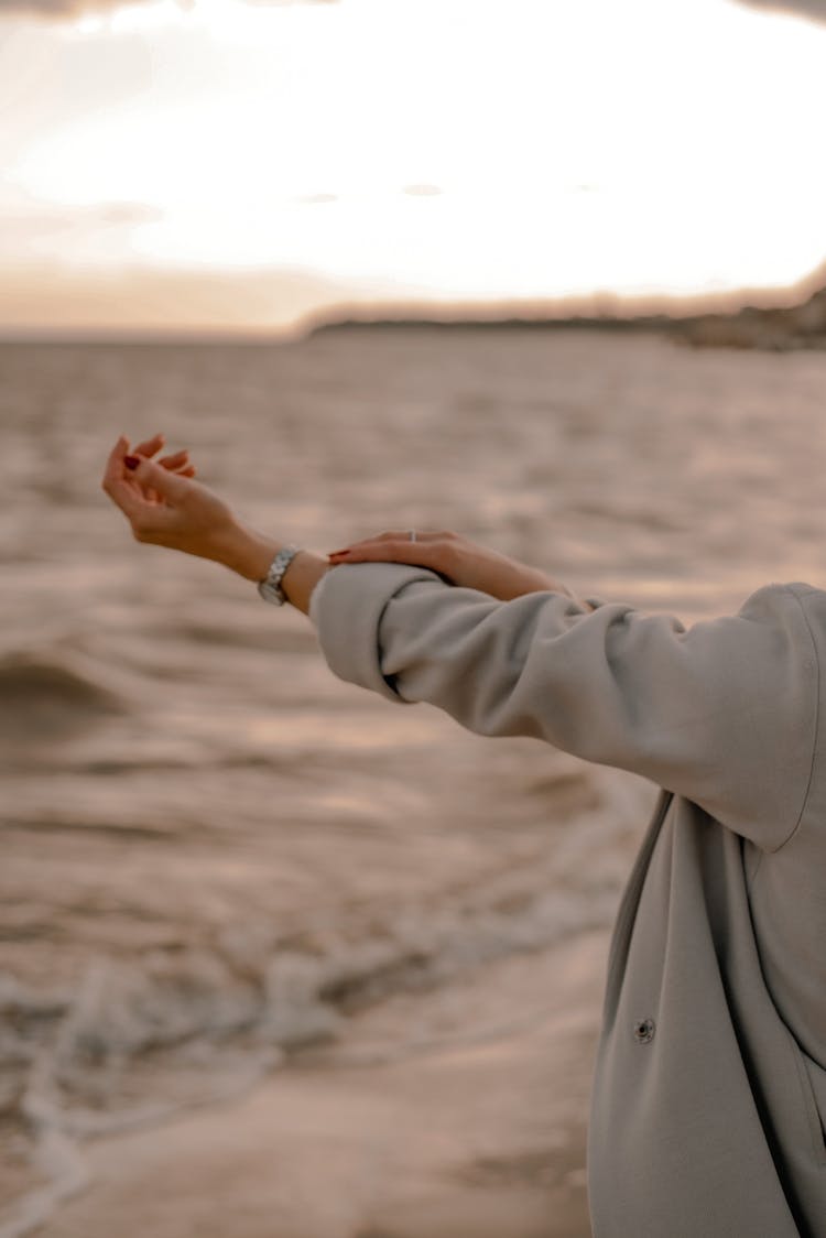 Female Arm And Sea Waves