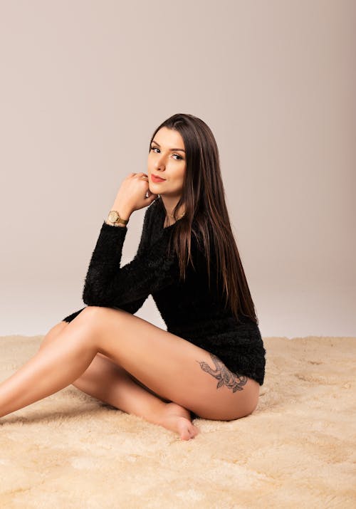 Woman Sitting on the Carpet Posing