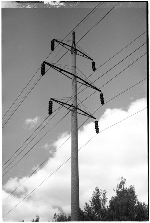 Grayscale Photo of Electric Post · Free Stock Photo