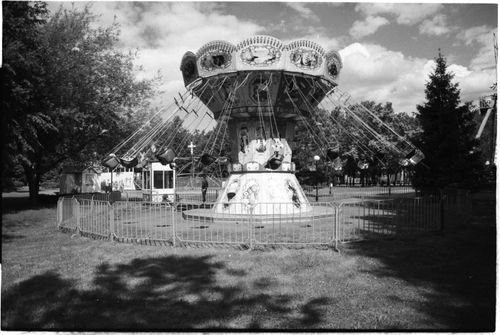 Free Classic black and white image of an empty carousel in a park setting. Stock Photo