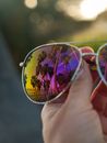 Reflection of Palm Trees in Aviator Sunglasses